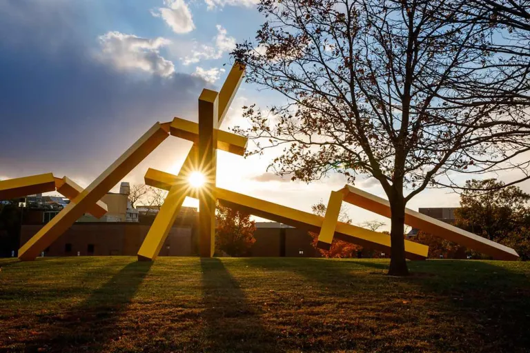 Sculpture on campus outdoor at sunset