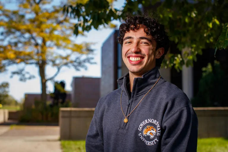 Latinx male student outdoors