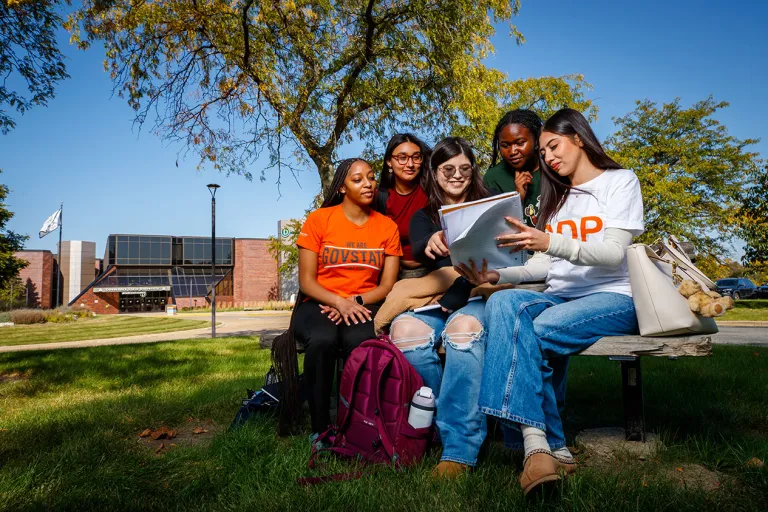 A group of people sitting on a bench