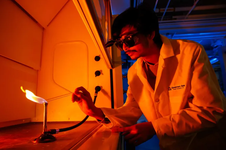 A male chemistry student in the lab