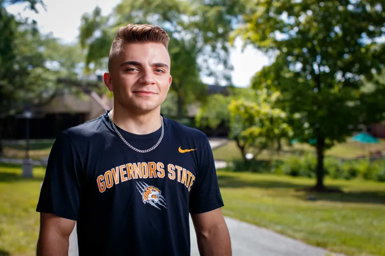 Caucasian male standing outdoors