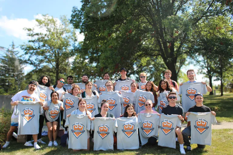 Mixed group of students posing outdoors