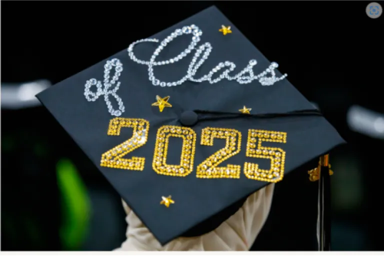 Image of person wearing a graduation mortar board with the words "class of 2025" on thop