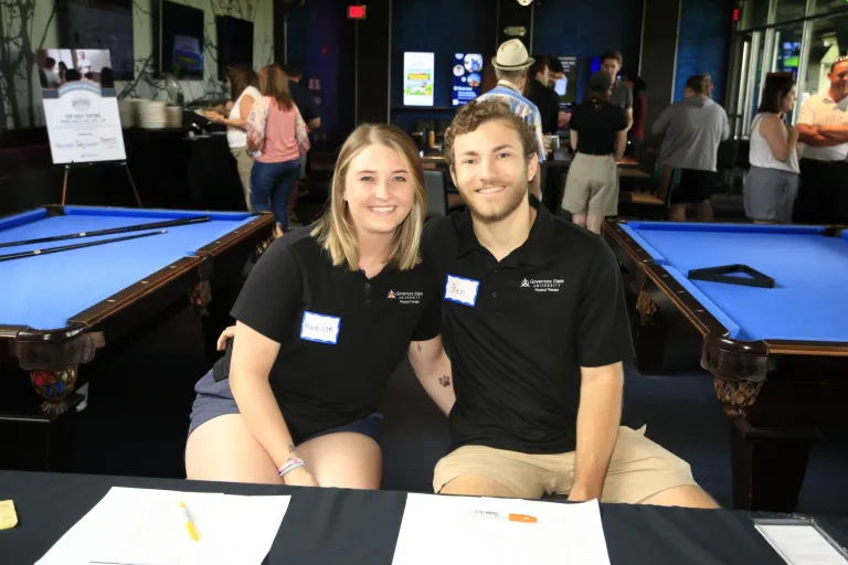Two physical therapy students at Top Golf