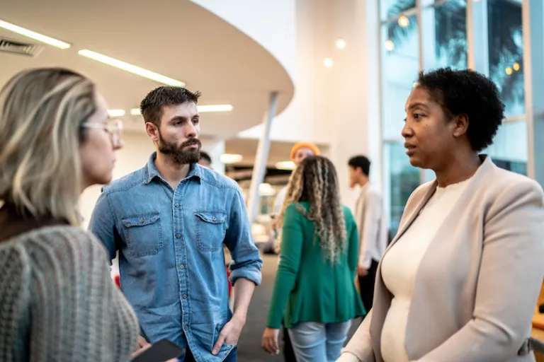 people conversing at community event