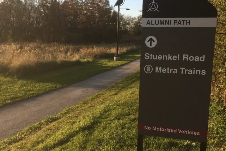 A picture of the Alumni Path looking west, taken during the afternoon.