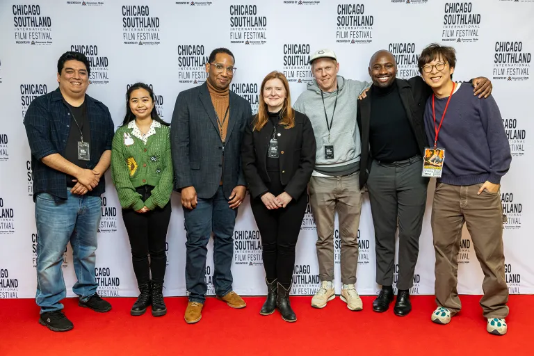 A group of people smiling
