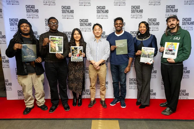 A group of people smiling