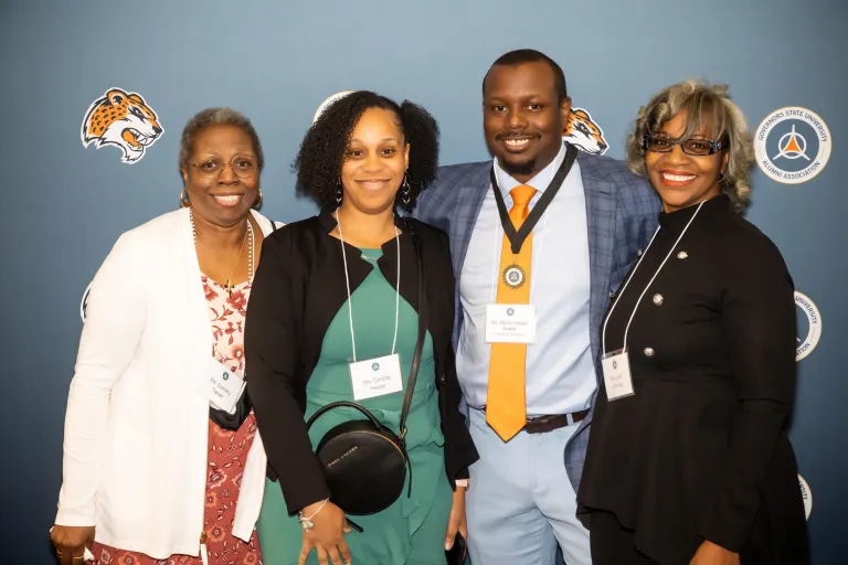 Group of people smiling at an event