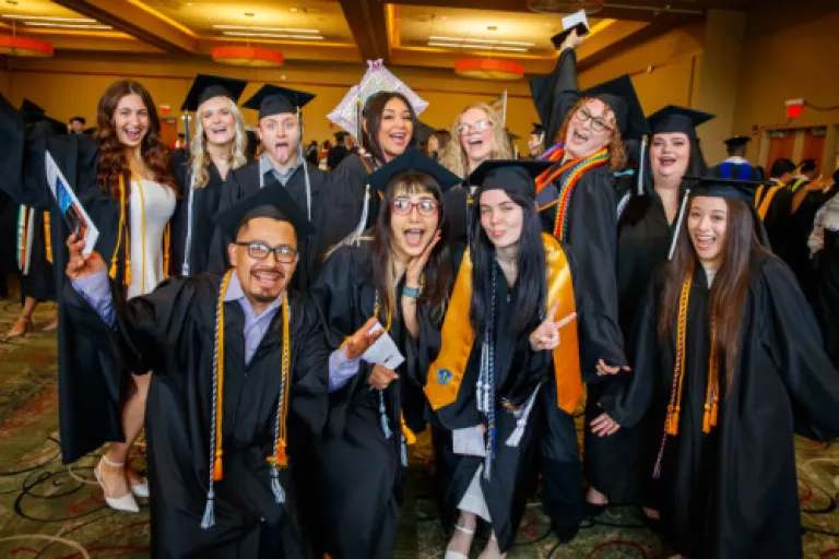 Graduates celebrating at a commencement ceremony.