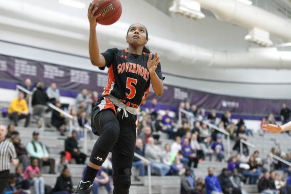 Women's Basketball player going for a layup