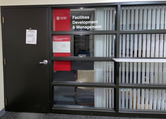 A picture of the Facilities Development and Management office window.
