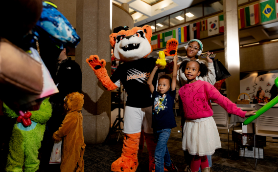 Jax with a group of children at the GovState Family Fun Fair