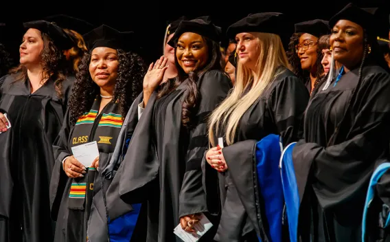 A group of people wearing graduation caps and gowns