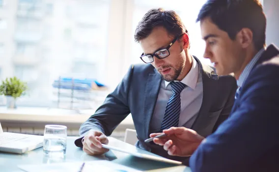 two males discussing business