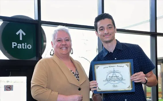 Honors student receiving an award