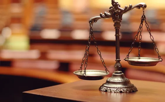 Judgement scale on desk