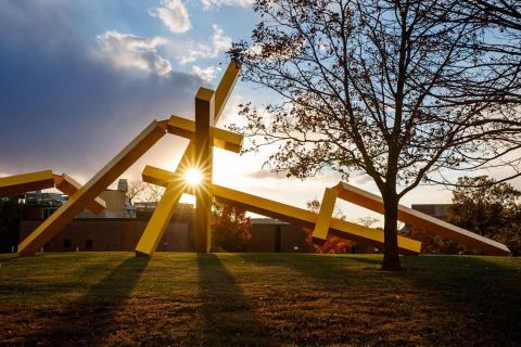 Sculpture on campus outdoor at sunset